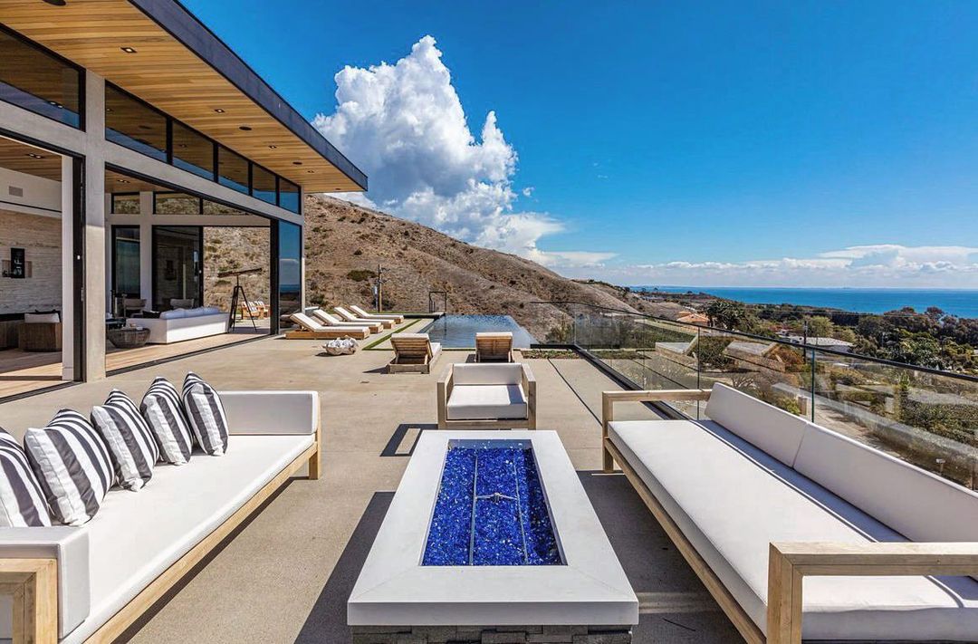 Proud to list this new Malibu home…. @soldbygold and @unvarnisheddotco NEW Construction epic views in heart of #malibu Enter through a private gated driveway, and indulge the lifestyle offered by this stunning architectural residence in Malibu that’s been crafted using quality features. Inside, an abundance of natural light welcomes you to discover floor-to-ceiling windows featuring breathtaking views of the ocean. Life-in the main living areas equipped with a home automation system, built-in surround speakers, and a Plum wine preservation system. In the open-concept kitchen. There are 5 bedrooms spread throughout the impressive floorplan, including the master suite featuring a chic fireplace, walk-in closet under skylights, and an ensuite with honed Carrara slab marble walls, plus you’ll….. well you get the picture, so much too see…. private showings are available
