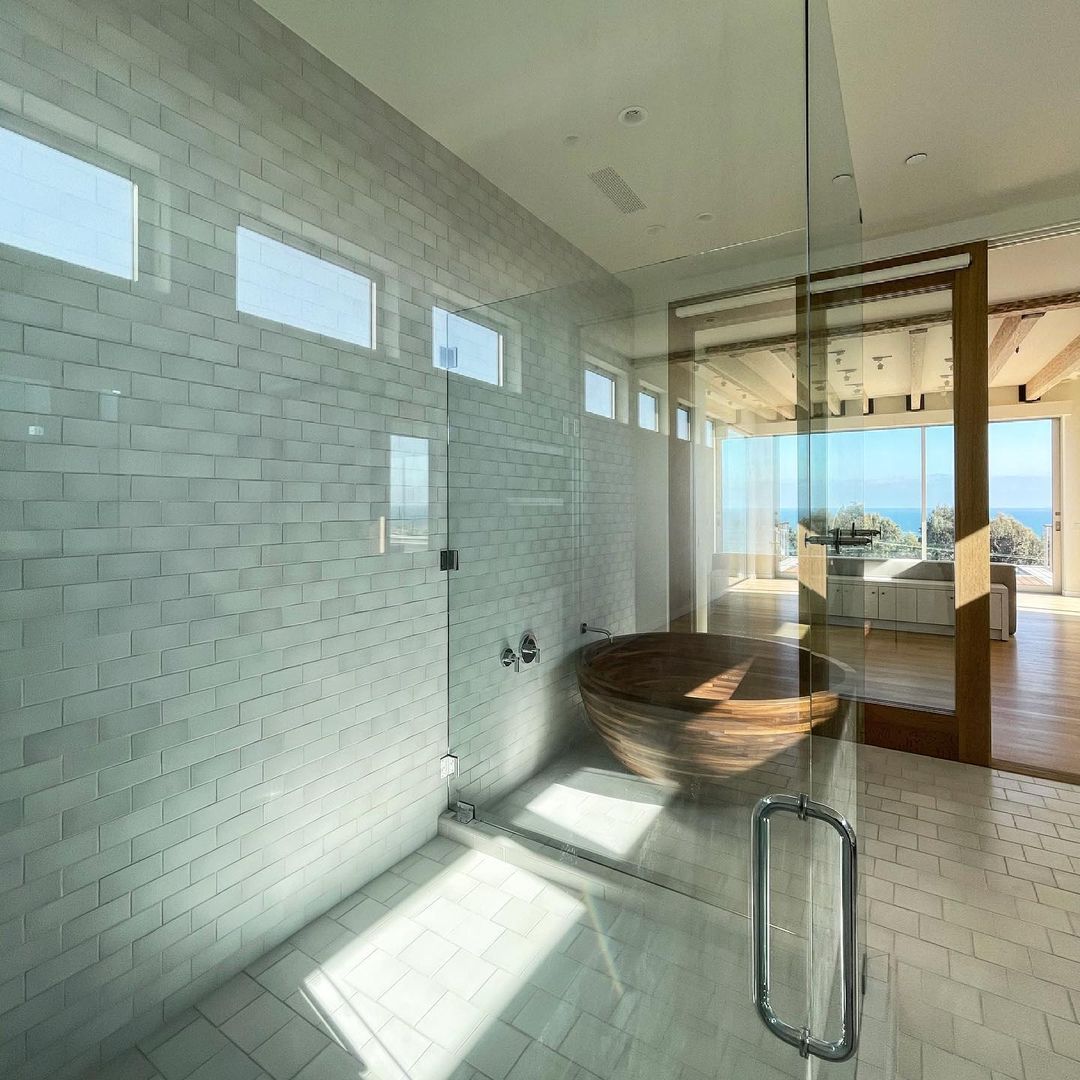 Handmade tiles and handmade doors with a small handmade solid walnut soaking tub, I love designing bathrooms. If you were brave, you would shower   just like this…. Any takers.? SOLD #scottgillendesign #newconstuction #malibu