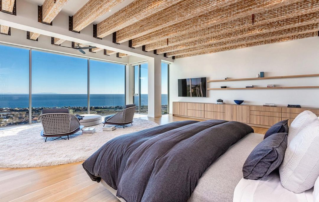 The master suite at The New Castle. Custom beams, custom furnishings, automatic shades, Bulthaub cabinetry, soaking tub, a massive walk in closet, private deck and one epic view. Available for private showings now. #scottgillendesign #malibu #thenewcastle