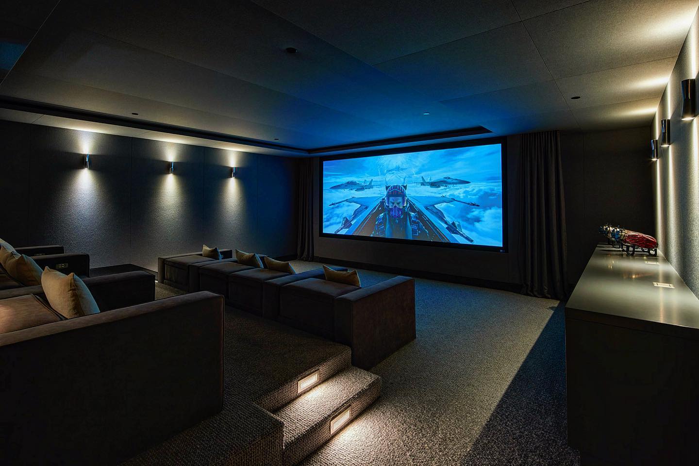 Acoustically, engineered and completely soundproof, this room floats. A proper media room that doesn’t touch the actual structure is the only way to go. Perforated screen laser projector and 32 pairs of speakers. This just might blow your skirt up. #scottgillendesign #private #guardgatedcommunity #thecase #midcenturymodern #estates